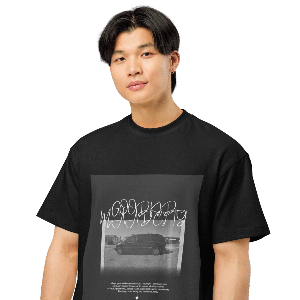 A person wearing a black tshirt with the kendrick lamar's album good kid maad city