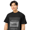 Front-facing view of a black men’s box-fit t-shirt with a structured silhouette and classic crew neckline. Displayed against a neutral background, the shirt’s deep tone and clean lines reflect the bold, minimalist aesthetic of the “Good Kid Maad City” collection—channeling lyrical grit and urban fashion into a sleek, wearable statement.
