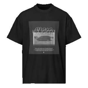 Front-facing view of a black men’s box-fit t-shirt with a structured silhouette and classic crew neckline. Set against a neutral background, the shirt’s deep tone and clean lines reflect the bold, minimalist aesthetic of the “Good Kid Maad City” collection—capturing lyrical grit and urban fashion in a sleek, wearable form.