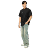 Left-front angled view of a men’s box-fit t-shirt in solid black, featuring a structured silhouette, relaxed sleeves, and classic crew neckline. Set against a neutral background, the shirt’s deep tone and clean lines reflect Rap Stitches’ music-inspired streetwear—fusing everyday comfort with bold, minimalist style.