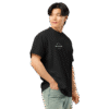 Right-front angled view of a men’s box-fit t-shirt in solid black, featuring a structured silhouette, relaxed sleeves, and classic crew neckline. Set against a neutral background, the shirt’s clean lines and deep tone reflect Rap Stitches’ music-inspired streetwear—fusing everyday comfort with bold, minimalist style.