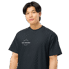 Portrait view of a person wearing a men’s box-fit t-shirt in navy blue, featuring a structured silhouette, relaxed sleeves, and classic crew neckline. Set against a neutral background, the shirt’s deep tone and clean lines reflect Rap Stitches’ music-inspired streetwear—merging everyday comfort with bold, minimalist style.