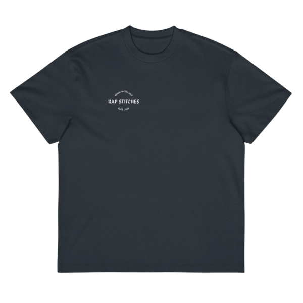 Front-facing view of a men’s box-fit t-shirt in navy blue, featuring a structured silhouette, relaxed sleeves, and classic crew neckline. Set against a neutral background, the shirt’s deep tone and minimalist design reflect Rap Stitches’ music-inspired streetwear—merging everyday comfort with bold, understated style