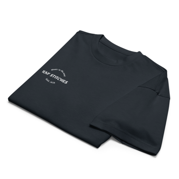 Front-facing view of a men’s box-fit t-shirt in navy blue, featuring a structured silhouette, relaxed sleeves, and classic crew neckline. Set against a neutral background, the shirt’s deep tone and minimalist design reflect Rap Stitches’ music-inspired streetwear—merging everyday comfort with bold, understated style.