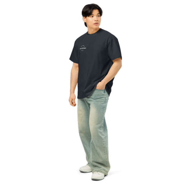 Left-front angled view of a men’s box-fit t-shirt in navy blue, featuring a structured silhouette, relaxed sleeves, and classic crew neckline. Displayed against a neutral background, the shirt’s deep tone and minimalist design reflect Rap Stitches’ music-inspired streetwear—blending everyday comfort with bold, understated style.