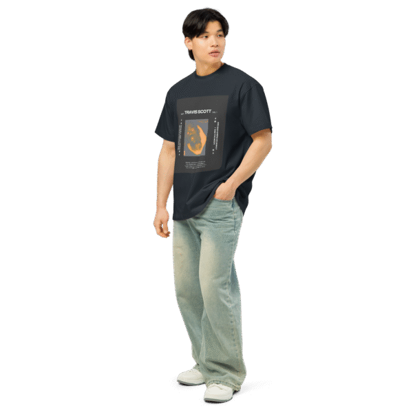 Left-front angled view of a navy blue men’s box-fit t-shirt with a structured silhouette and classic crew neckline. Displayed against a neutral background, the shirt’s bold color and clean lines reflect the confident, minimalist aesthetic of the Designer Travis Scott series—blending urban fashion with music-inspired design.