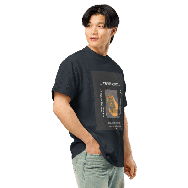 Right-angled front view of a navy blue men’s box-fit t-shirt with a structured silhouette and classic crew neckline. Displayed against a neutral background, the shirt’s bold color and clean lines evoke a confident, streetwear-inspired aesthetic—part of the Designer Travis Scott series blending music culture with minimalist fashion.