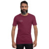 Front-facing view of a unisex maroon staple t-shirt with a structured silhouette and classic crew neckline. Displayed against a neutral background, the shirt’s rich color and minimalist design reflect Rap Stitches’ music-inspired streetwear—blending everyday comfort with bold, understated style.