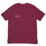 Front-facing view of a unisex maroon staple t-shirt with a structured silhouette and classic crew neckline. Set against a neutral background, the shirt’s rich color and minimalist design reflect Rap Stitches’ music-inspired streetwear—blending everyday comfort with bold, understated style.