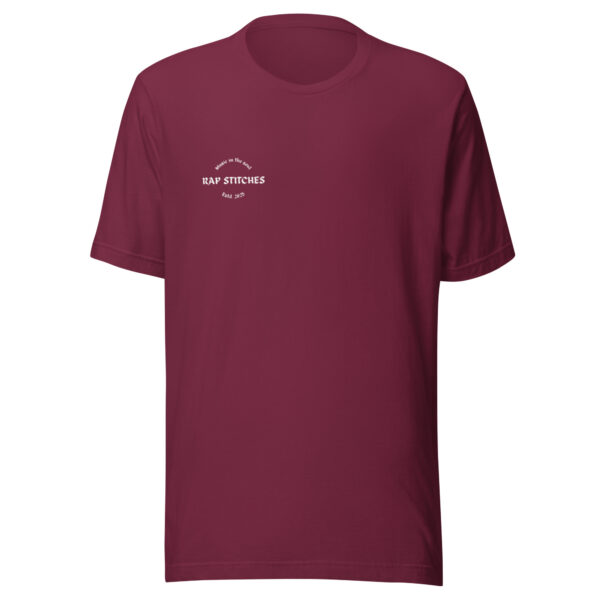 Front-facing view of a unisex maroon staple t-shirt with a structured silhouette and classic crew neckline. Displayed against a neutral background, the shirt’s rich color and minimalist design reflect Rap Stitches’ music-inspired streetwear—blending everyday comfort with bold, understated style.