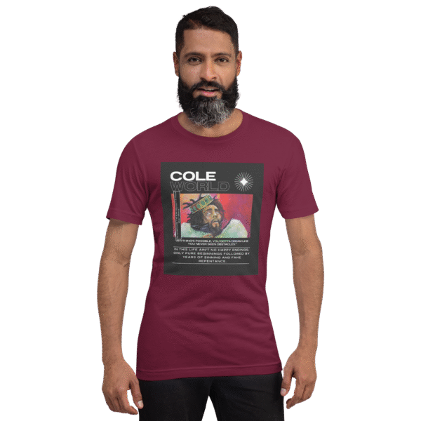 Front-facing view of a maroon unisex staple t-shirt with a relaxed fit and classic crew neckline. Set against a neutral background, the shirt’s smooth texture and rich color convey the understated, introspective vibe of the Cole World designer series—blending lyrical storytelling with everyday streetwear appeal.