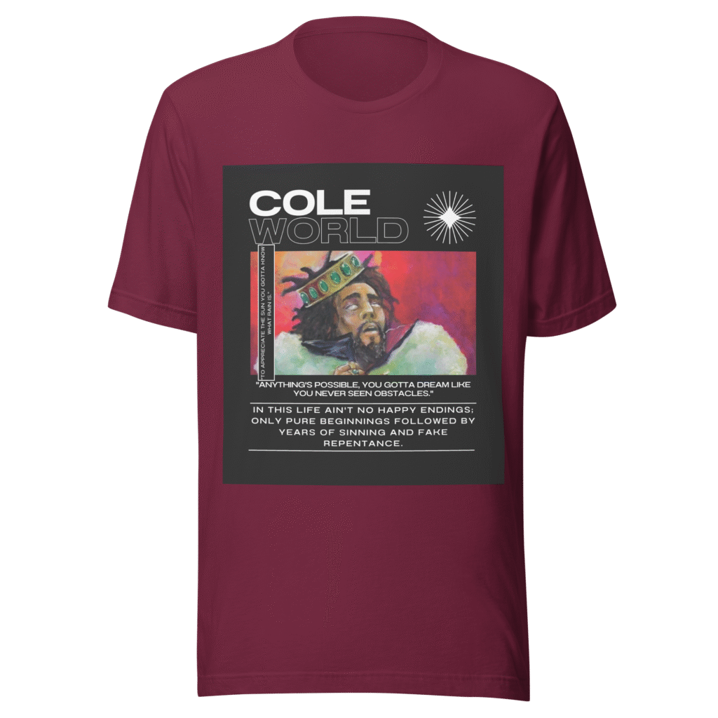 Front-facing view of a maroon unisex staple t-shirt with a relaxed fit and classic crew neckline. Set against a neutral background, the shirt’s smooth texture and deep color reflect the minimalist, introspective tone of the Cole World designer series—blending lyrical storytelling with everyday streetwear appeal