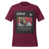 Front-facing view of a maroon unisex staple t-shirt with a classic crew neckline and relaxed fit. Set against a neutral background, the shirt’s smooth texture and deep color reflect the minimalist, introspective vibe of the Cole World designer series—blending everyday wearability with lyrical depth.