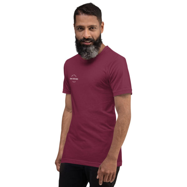Left-front angled view of a unisex maroon staple t-shirt with a structured silhouette and classic crew neckline. Displayed against a neutral background, the shirt’s deep hue and minimalist design reflect Rap Stitches’ music-inspired streetwear—blending everyday comfort with bold, understated style.