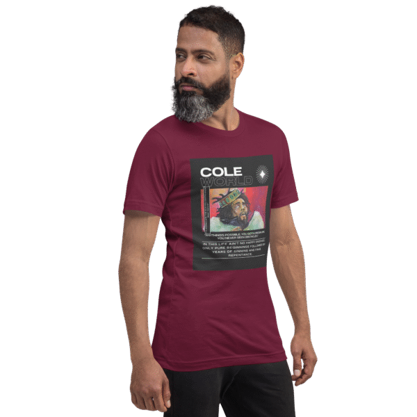 Front-right view of a maroon unisex staple t-shirt displayed against a plain background. The shirt features a clean, minimalist cut with short sleeves and a crew neckline, emphasizing its casual and versatile design.