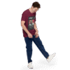Front-right view of a maroon unisex staple t-shirt displayed against a plain background. The shirt features a clean, minimalist cut with short sleeves and a crew neckline, emphasizing its casual and versatile design.