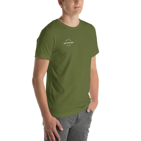 Right-front angled view of a unisex olive green staple t-shirt featuring a structured silhouette and classic crew neckline. Displayed against a neutral background, the shirt’s earthy tone and clean lines reflect Rap Stitches’ minimalist, music-inspired aesthetic—blending everyday comfort with bold, streetwear sensibility.